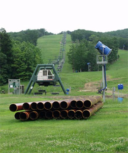 Whitetail is investing $1.4 million in capital improvements this summer.  Above, new snowmaking lines are replaced at Whitetail's base area.
