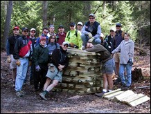 Weary trail volunteers  take a break after working on trail preparations for the 24 Hours  of Snowshoe race.