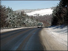A freshly-plowed road marks the beginning of a long trip home.