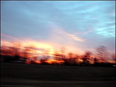 The sun dips below the horizon at 4:47 p.m., breathing a final sigh of bright red and orange.
