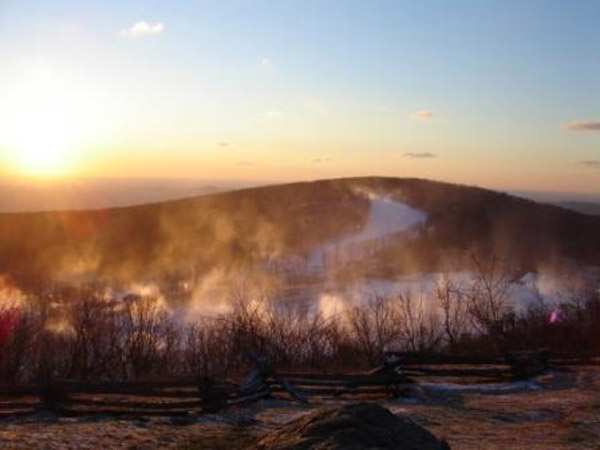 The sun rises Wednesday morning as Wintergreen blasts its slopes with snowmaking.  Wintergreen plans to re-open on Thursday morning.