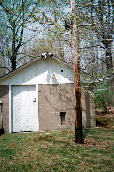 The rope would enter the building through the rectangular opening near the ground, and exit the building very neatly through the small hole above that.  The other drive station remains in place and is very similar to this one.