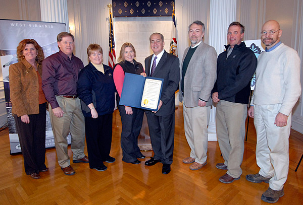 From left to right: WV Tourism Commissioner Better Carver, Sport Mart Owner Buddie Clendenin, Canaan Valley Resort Sales & Marketing Director Lisa Ratliff, Snowshoe Mountain Communications Manager Laura Parquette, WV Governor Earl Ray Tomblin, Timberline Four Season Resort Owner Fred Herz, Winterplace Ski Resort President Terry Pfeiffer, and WV Ski Areas Association Communications Director Joe Stevens.