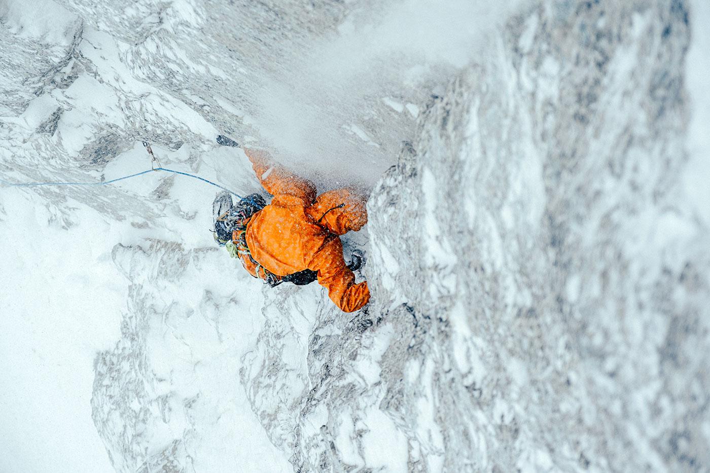An athlete wearing Arc’teryx outerwear climbs through harsh alpine conditions, highlighting the kind of technical performance the company is pairing with newer approaches to repairability, recycled materials, and circular design. An athlete wearing Arc’teryx outerwear climbs through harsh alpine conditions, highlighting the kind of technical performance the company is pairing with newer approaches to repairability, recycled materials, and circular design.